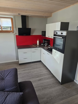 Coffee/tea maker, fridge, microwave, oven