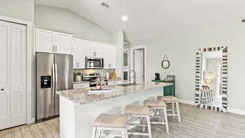 Coffee/tea maker, fridge, microwave, oven