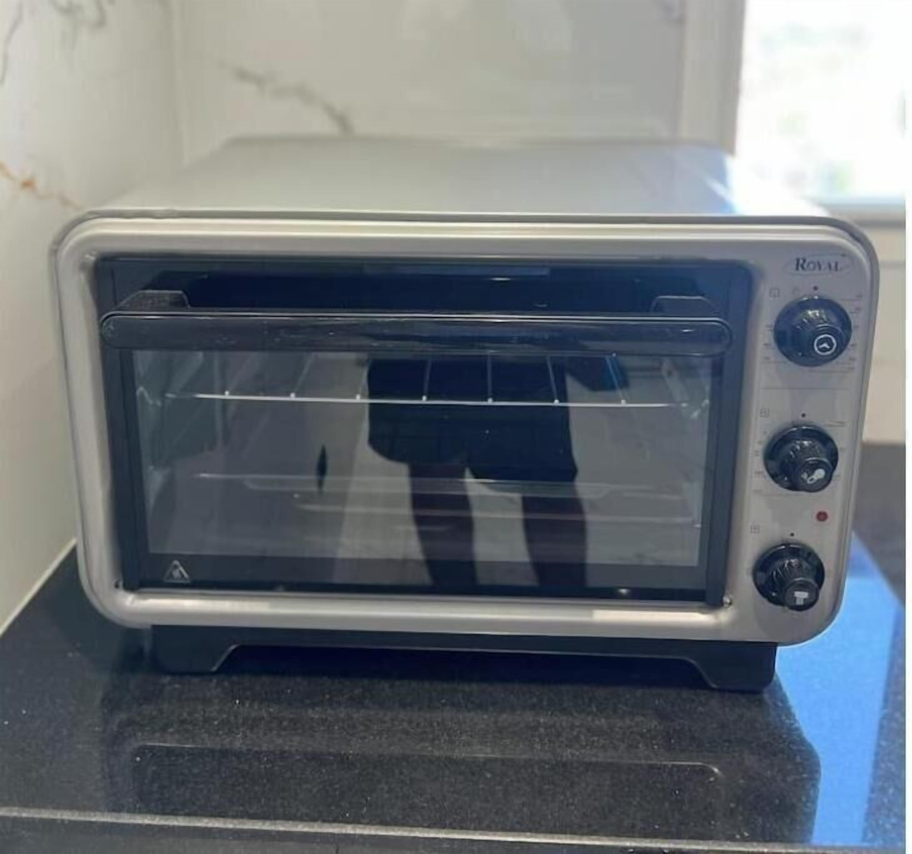 A countertop with a silver toaster oven.