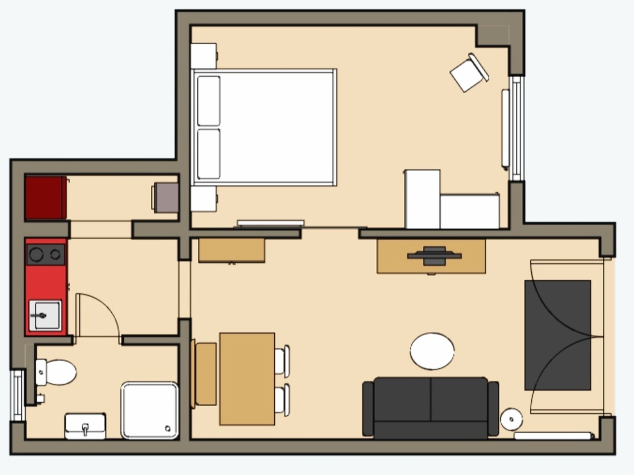 Ein Grundriss mit Küche, Essbereich, Wohnzimmer und einem separaten Badezimmer.
