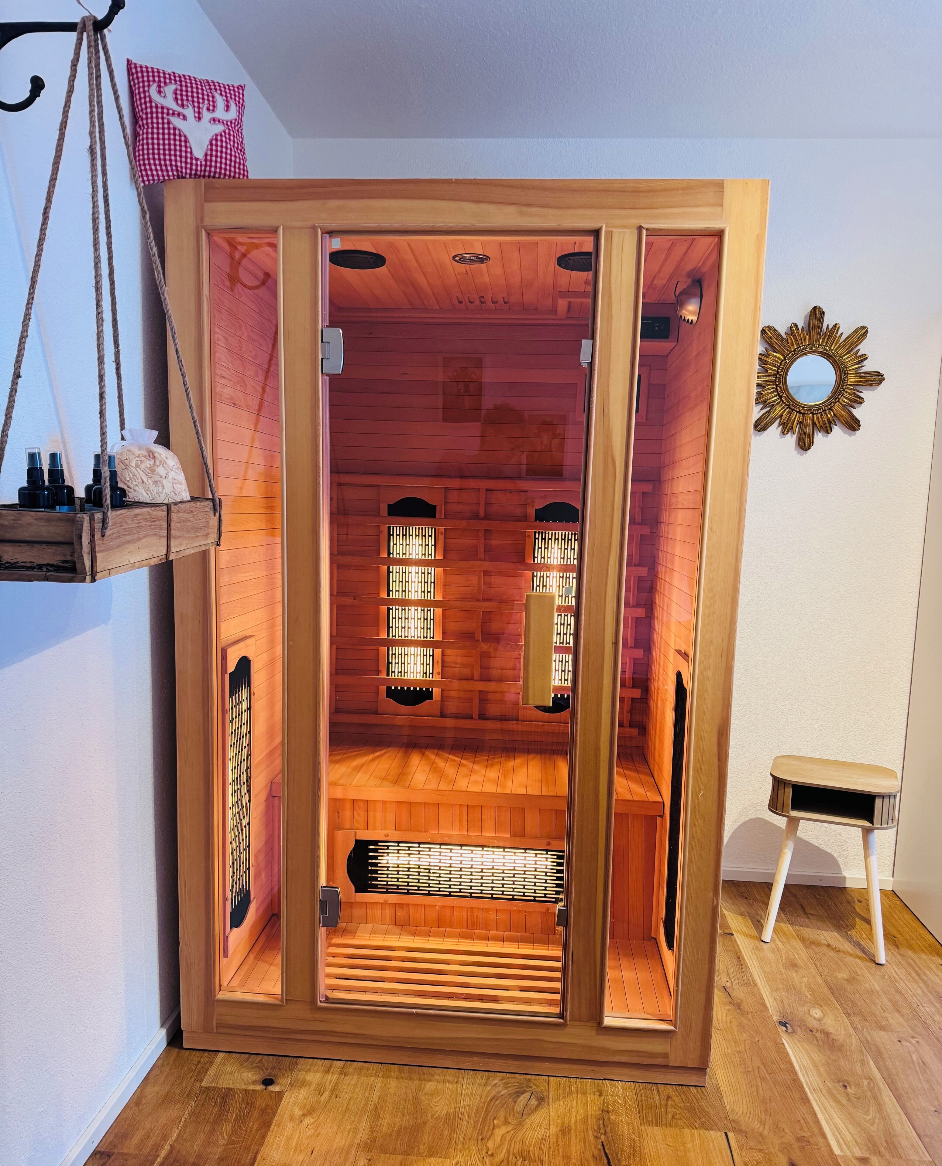 A sauna with wooden walls and a bench inside.