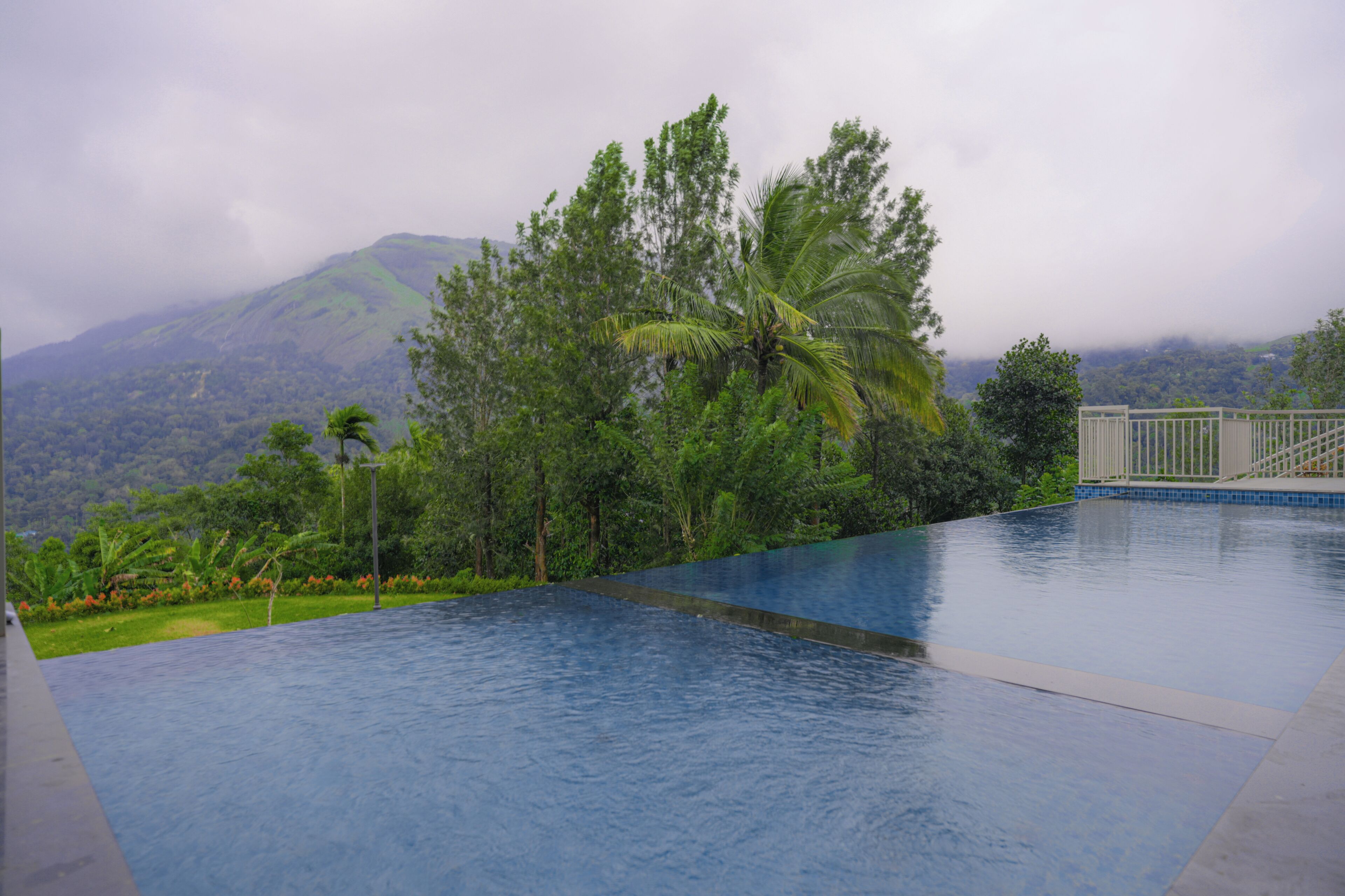 A swimming pool with a view of a mountainous landscape.
