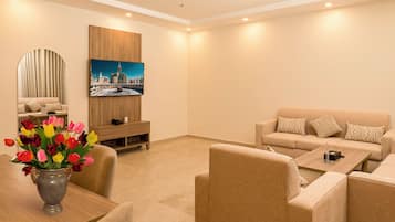 Suite familiar, 2 habitaciones | Área de sala de estar
