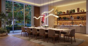 A modern dining area with a large table, chairs, and a view of greenery outside. - Luxury 1-Bedroom Residence at Viceroy Brickell (Miami)