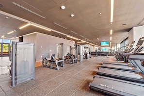 A gym with treadmills, weight machines, and free weights. - Luxury 21BR - Resort-Style Pool - Central Miami (Miami)
