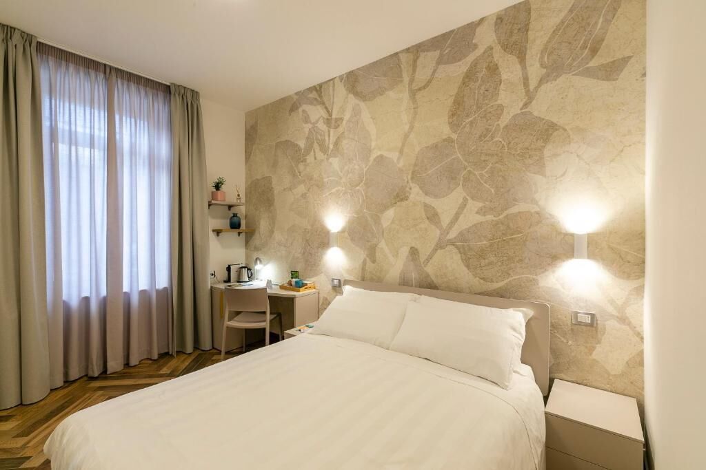 Habitación cuádruple Deluxe (Aida) | Caja fuerte, sistema de insonorización, tabla de planchar con plancha