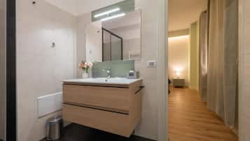 Deluxe Double Room, Courtyard View | Bathroom | Shower, free toiletries, hair dryer, towels
