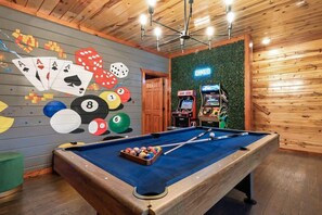 A pool table with a blue felt surface, surrounded by a wooden frame. - Brand New Design! Huge Pool Cabin@ Blackhawk Lodge (Sevierville)