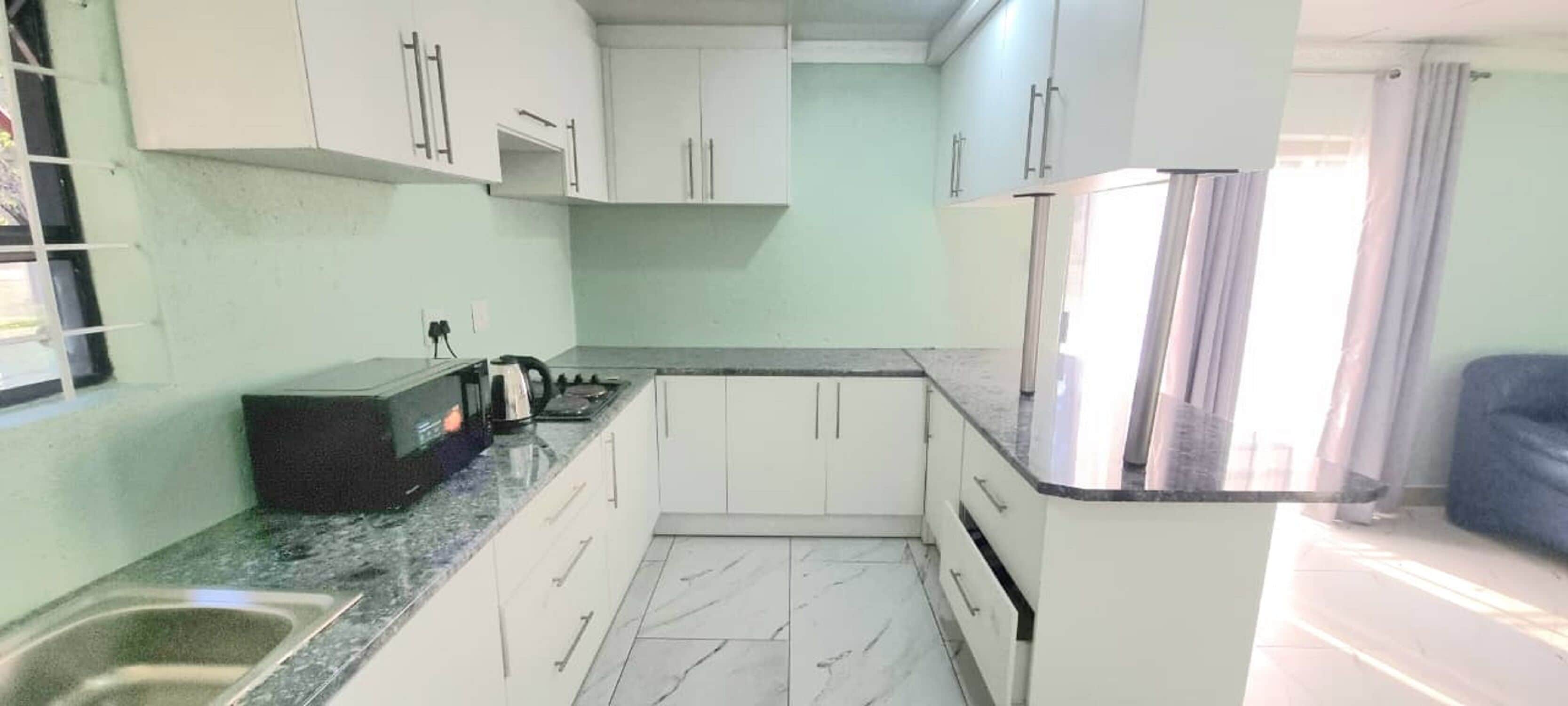 Full-size fridge, microwave, stovetop
