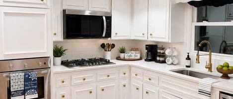 Coffee/tea maker, fridge, microwave, oven