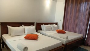 A hotel room with two single beds, each with white bedding and pillows, and a wooden headboard. - Silina Airport Residence & Transit Hotel (Katunayake)