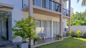 A modern two-story building with a balcony, large windows, and a well-maintained lawn. - Silina Airport Residence & Transit Hotel (Katunayake)