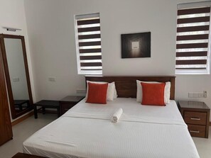 Deluxe Double Room, Patio, Garden View | In-room safe, desk, laptop workspace, blackout curtains