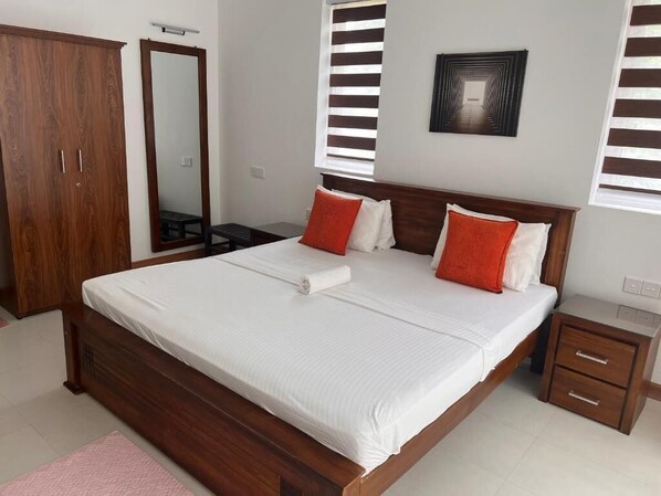Deluxe Double Room, Patio, Garden View | In-room safe, desk, laptop workspace, blackout curtains