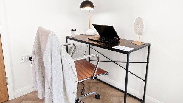 A workspace with a desk, laptop, lamp, and a chair. - Hybrid Resi - Mitcham - Two-Bedroom Apartment (Mitcham)