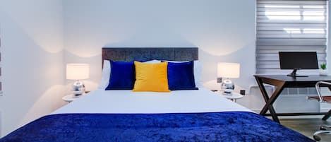 1 bedroom, desk, iron/ironing board, travel crib