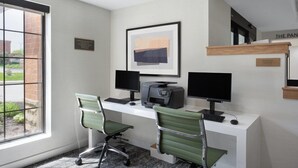 A modern office with two desks, computers, and chairs. - Studio Suite w/ Jetted Tub | Free Breakfast! (West Des Moines)