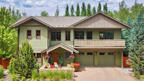 A two-story house with a front porch, a garage, and a driveway. - Abode at Ketchum Escape, walk to Main St, ensuites (Ketchum)