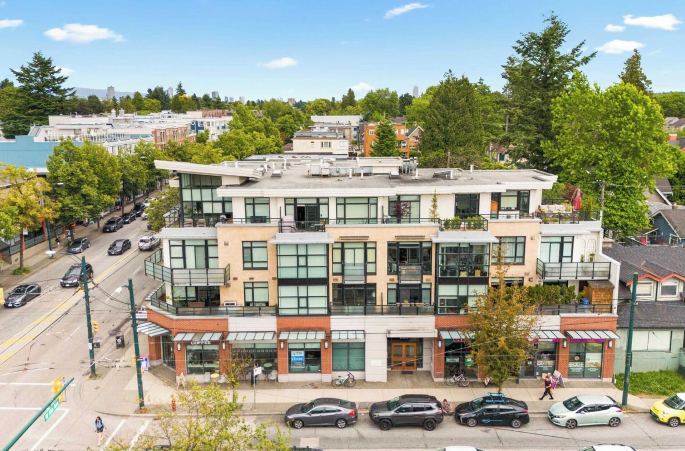 A multi-story building with a ground-level coffee shop and upper-level residential units.