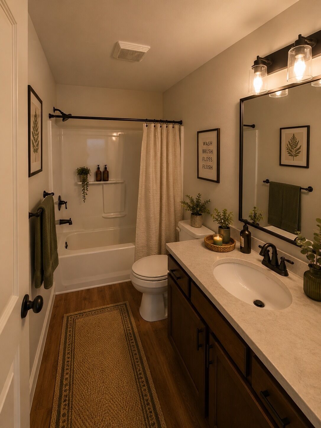 A bathroom with a bathtub, toilet, sink, and a shower curtain.