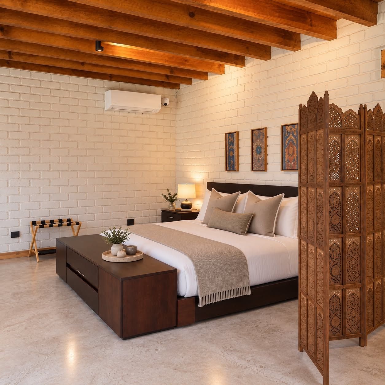 A bedroom with a wooden bed, a nightstand, a bedside table with a lamp, a bench, and a decorative screen.