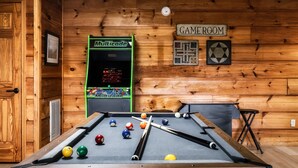 A pool table with balls, a Multicade video game, and a 'GAME ROOM' sign. - VIEWS! / Hot Tub / Nintendo Switch / Games! (Sevierville)