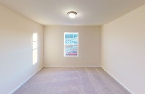 A room with a carpeted floor, a ceiling light, a window with a view of a building and a car, and plain walls. - Near Shelbyville, TN. Perfect for long term stays (Murfreesboro)