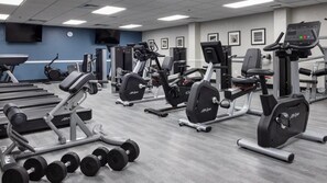 A gym with various exercise equipment, including treadmills, weight machines, and dumbbells. - Family Escape at Holiday Inn Club Vacations Orange Lake (Kissimmee)