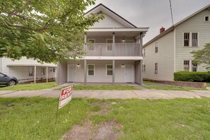 A two-story building with a balcony, a 'For Rent' sign, and a '505' address number.