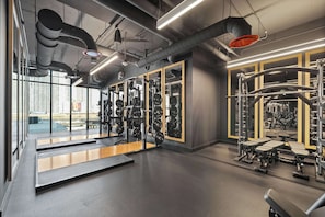 Gym with mirrored walls and strength machines. - E11EVEN Residences Luxury Double Suite in Downtown Miami (Miami)