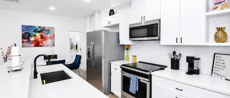 Coffee/tea maker, fridge, microwave, oven