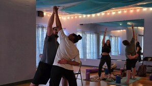A yoga class in a room with wooden floors, yoga mats, and blocks. - Desert Estate at the Base of the Superstition Mountains (Apache Junction)