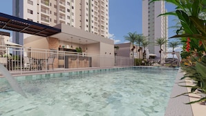 A swimming pool with a sunshade, surrounded by a fence, and a bar area with chairs and tables. - Pertinho do Mar, Brisa da Praia e 2 Quartos (Fortaleza)