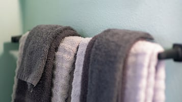A towel rack with two towels.
