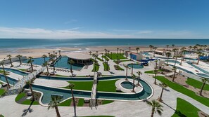 A resort with multiple swimming pools, palm trees, and a beach view. - R504 Beachfront 3BR Condo with Ocean Views and Private Balcony at Encantame Soleil (Puerto Peñasco)