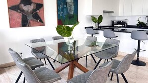 A modern kitchen with white cabinets, a black countertop, and a built-in oven. - TOP/4BR/Million Dlls Sea Views/4 Balcony/Padel/Gym (Cancún)