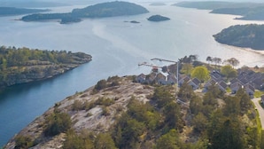A coastal area with a residential complex, a dock, and a bridge. - 5 Star Holiday Home in Uddevalla (Uddevalla)