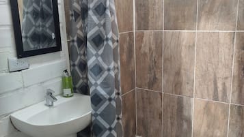Shower, towels, soap, toilet paper