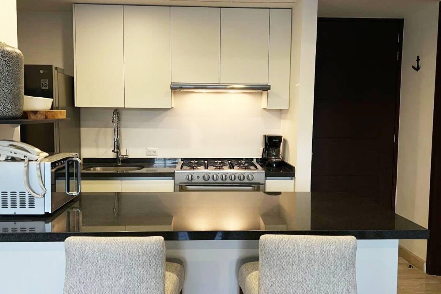 Coffee/tea maker, fridge, microwave, oven