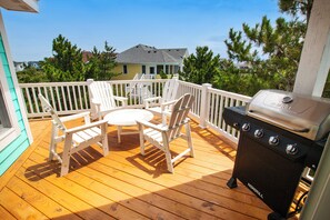 A wooden deck with outdoor furniture and a grill. - Oceanside, 2 Hot Tubs- 2 Duplex's rents as 1-BU22, Love R Shack at the Beach (Corolla)