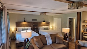A hotel room with two beds, a sofa, and a wooden headboard. - Newly Renovated Slopeside Condo at Bryce Resort. Family and pet-friendly! (Mount Jackson)