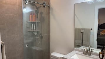 Shower, hair dryer, towels, soap