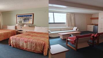 A hotel room with two beds, a sofa, a desk, and a kitchenette.