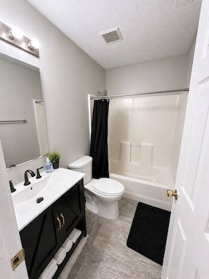 Hair dryer, towels, soap, toilet paper
