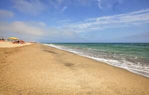 A beach with a sandy shore and a clear sky. - 5 bedroom cozy home in Sainte Marie La Mer Pl (Sainte Marie La Mer Pl)