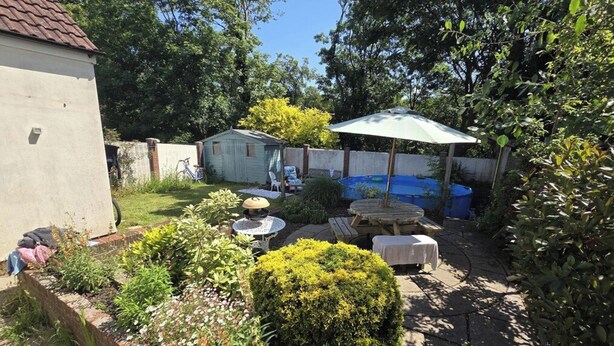 A backyard with a pool, outdoor furniture, and a shed. - 1 Bed - Sleeps 2 plus child - Garden - Pets (Bristol)