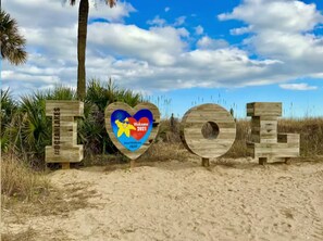 Wooden letters spelling 'TOOL' with a heart-shaped sign in the middle. - Emmas Beach Hut 2 KING BEDS 3 min to beach (Myrtle Beach)
