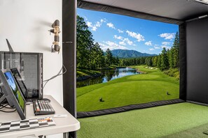 A room with a desk, computer, and a large window with a view of a golf course and mountains. - Skyline 3 Homes Retreat, Private Swim Spas, SLP 48 (Washington)