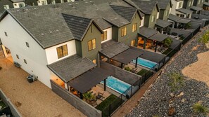 A residential complex with multiple houses, a swimming pool, and outdoor seating areas. - Skyline 3 Homes Retreat, Private Swim Spas, SLP 48 (Washington)