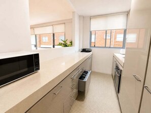 Private kitchen - BREAM - Coogee Coastal Retreat | Sunny 2-Bed With Balcony & Lock-Up Garage (Coogee)
